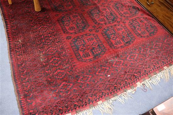 A red ground Persian rug, 320 x 225cm